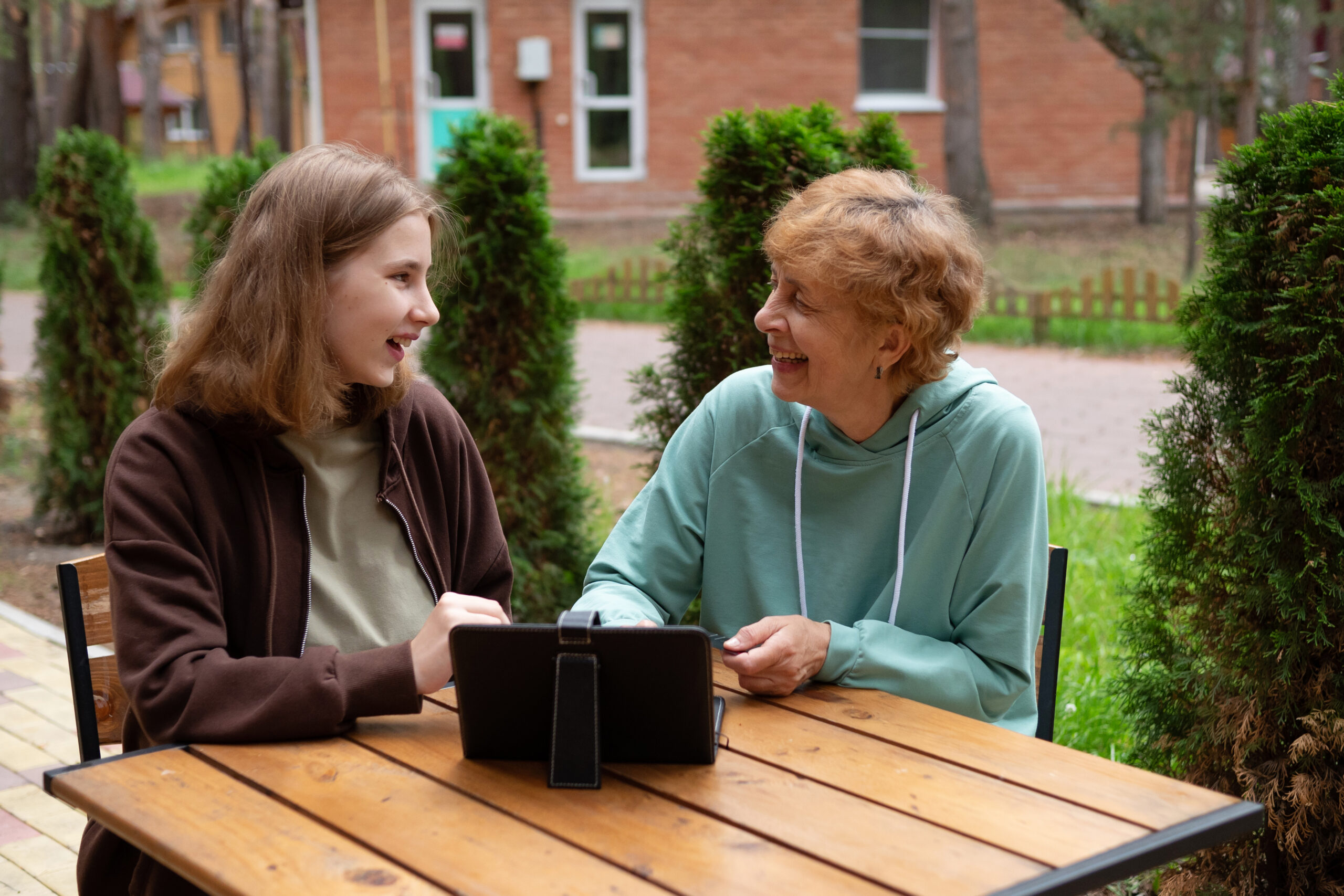 A teenage girl and an older woman spend time together.